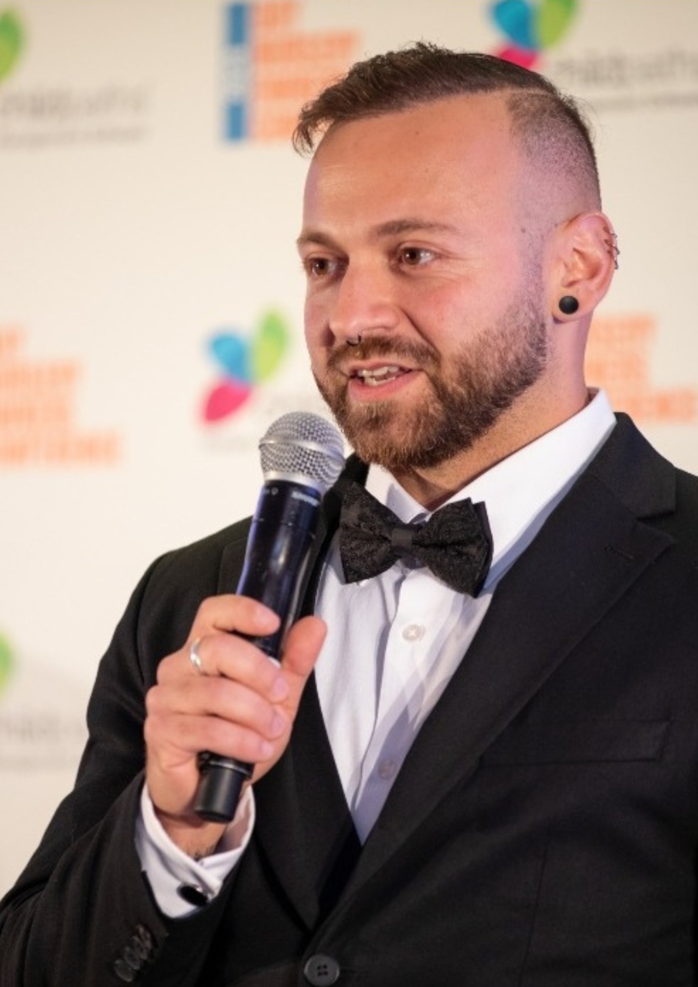 Claudio Sisera speaking on stage